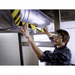 Tesa  PREMIUM (04169-00063-93) Padl&oacute;jel&ouml;lő szalag &reg; Professional Fekete/s&aacute;rga (H x Sz) 33 m x 50 mm 1 db